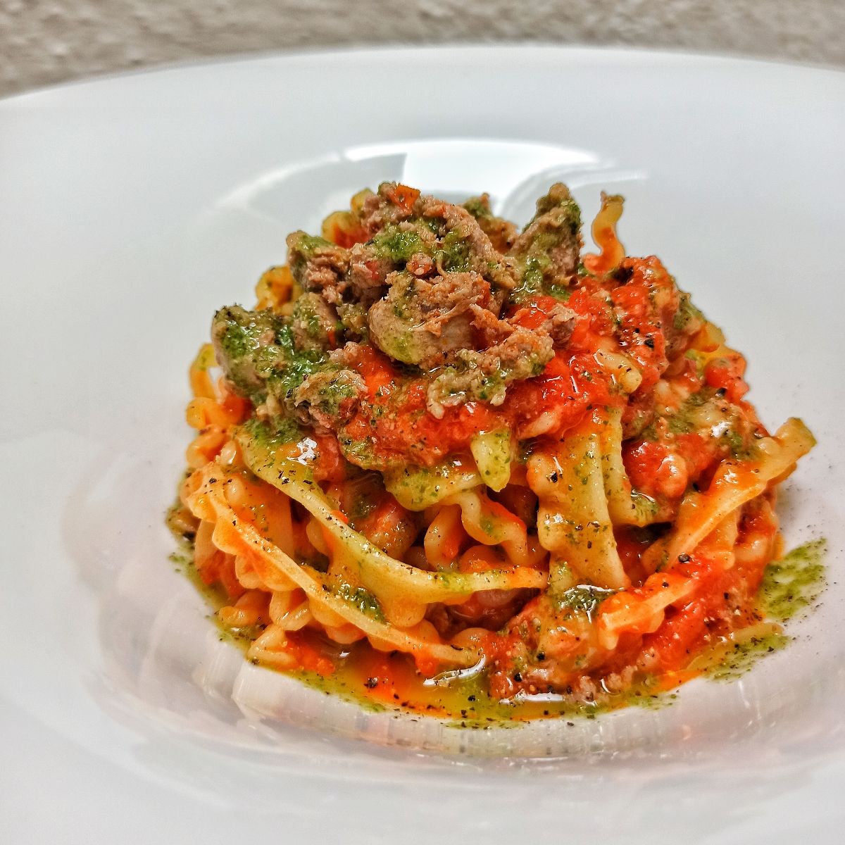 Regine con ragù di datterino salsiccia affumicata