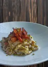 Ricetta Tortellini con crema di burrata al tartufo guanciale e pistacchio