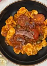 Ricetta Orecchiette con acciughe e pomodoro.