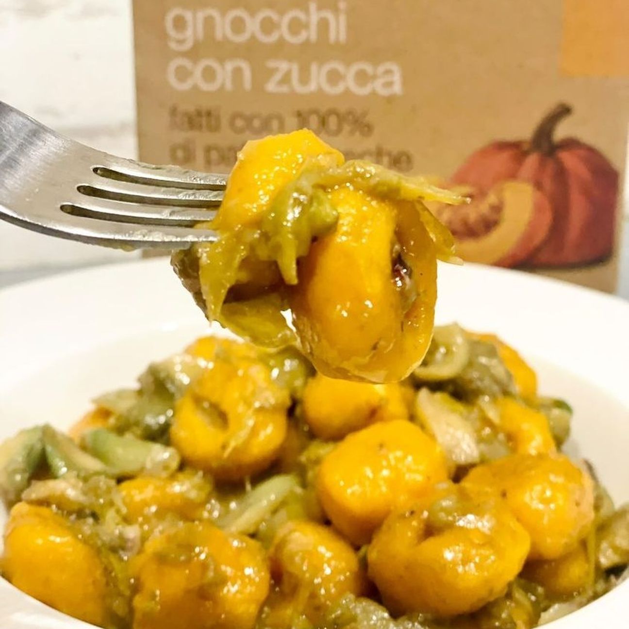 Gnocchi di zucca con sugo di carciofi e seppioline