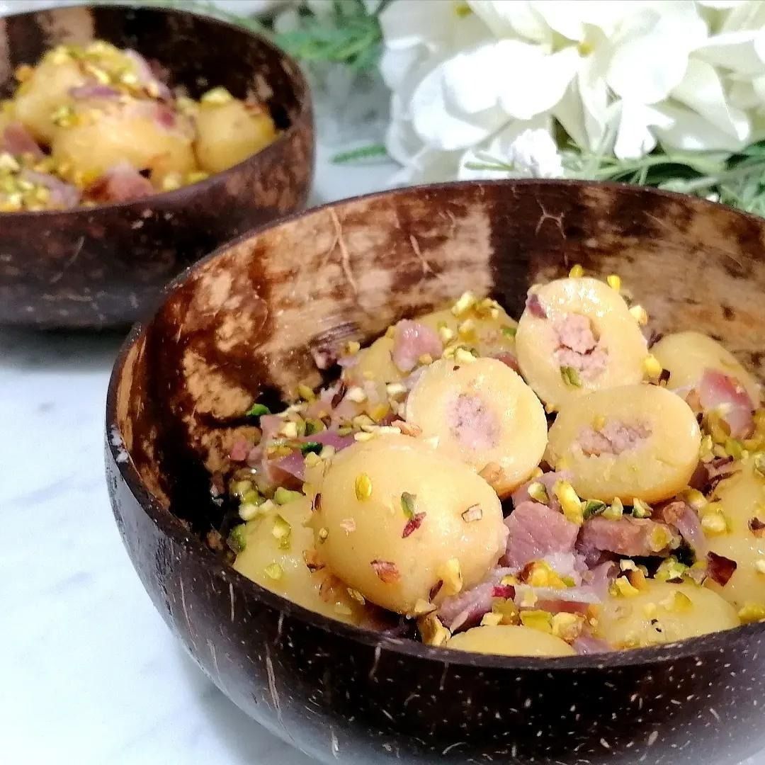 Gnocchi ripieni con speck e brie con pistacchi e prosciutto crudo