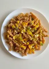 Ricetta Fusilli di lenticchie rosse con con peperoni, pomodorini gialli, parmigiano e basilico