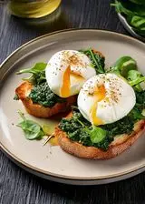 Ricetta Bruschetta con uova in camicia e spinaci saltati con pane tostato