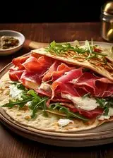 Ricetta Piadina con bresaola, ricotta e rucola