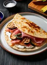 Ricetta Piadina con prosciutto cotto, ricotta e melanzane grigliate