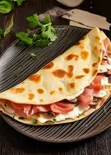 Ricetta Piadina con prosciutto cotto, ricotta, funghi e prezzemolo