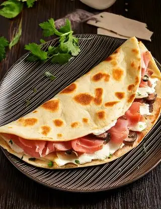 Ricetta Piadina con prosciutto cotto, ricotta, funghi e prezzemolo di eltamain