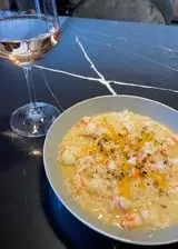 Ricetta Risotto alle mazzancolle, arancia e granella di pistacchi