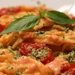 Ricetta Trofie con crema di burrata e pomodorini e parmigiano al basilico