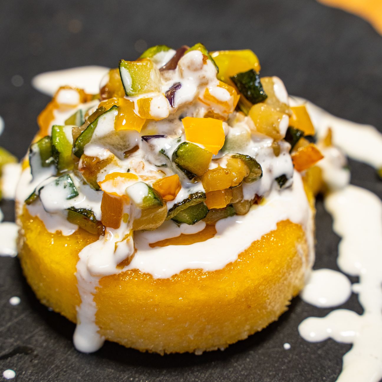 Quadrotti di polenta con fonduta di Grana Padano