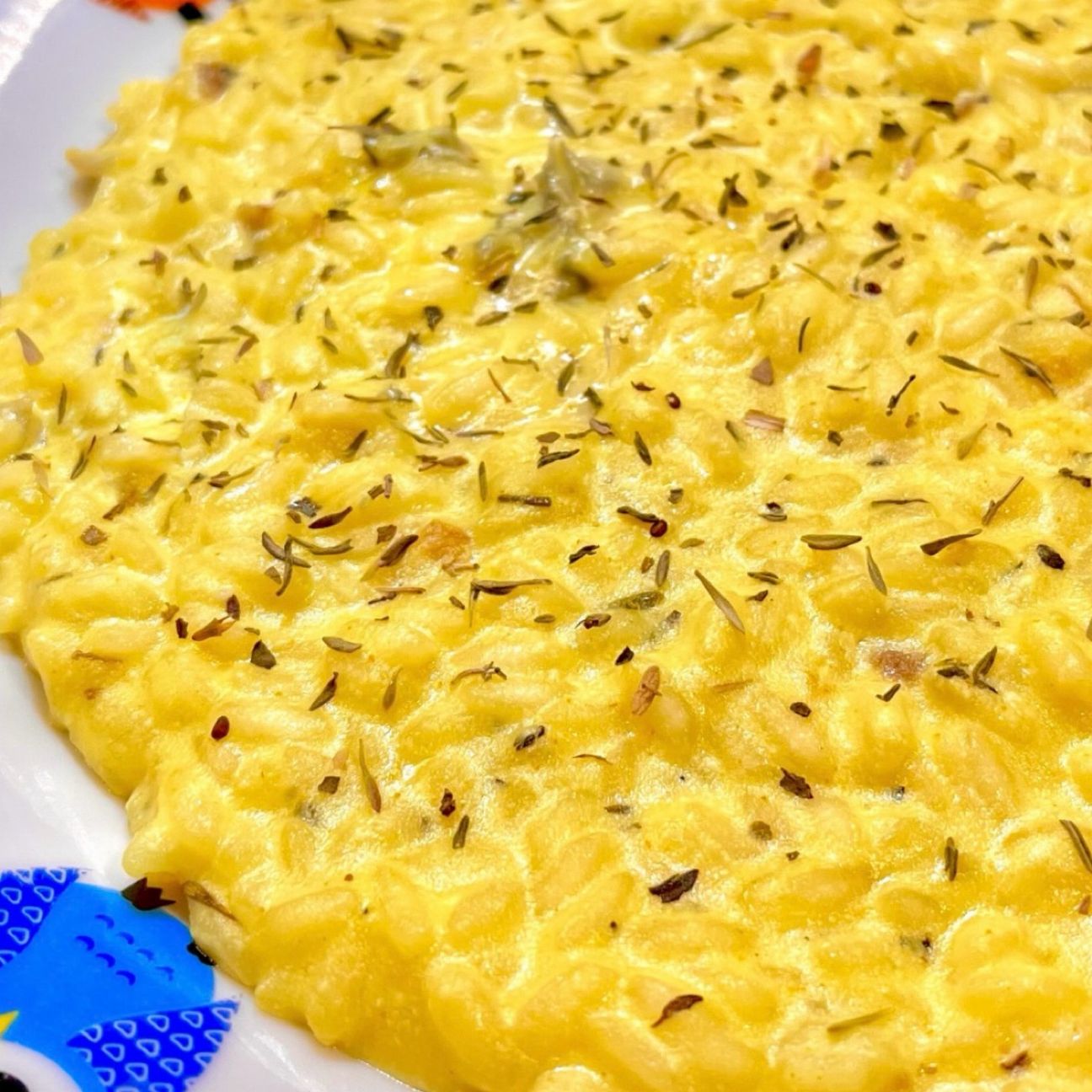 Risotto con ricotta, gorgonzola, zafferano, erbe aromatiche