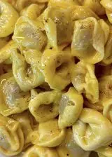 Ricetta Tortellini emiliani con zabaione di parmigiano