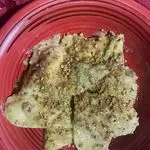 Ricetta Ravioli al pesto di pistacchio ripieni di ricotta mortadella e granella