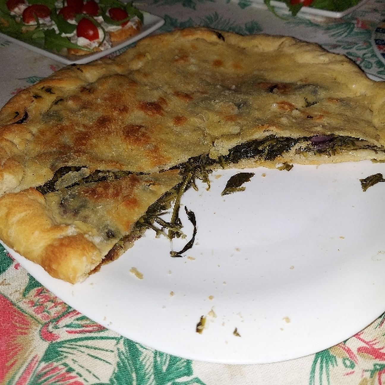 Pizza ripiena con erbette di campo