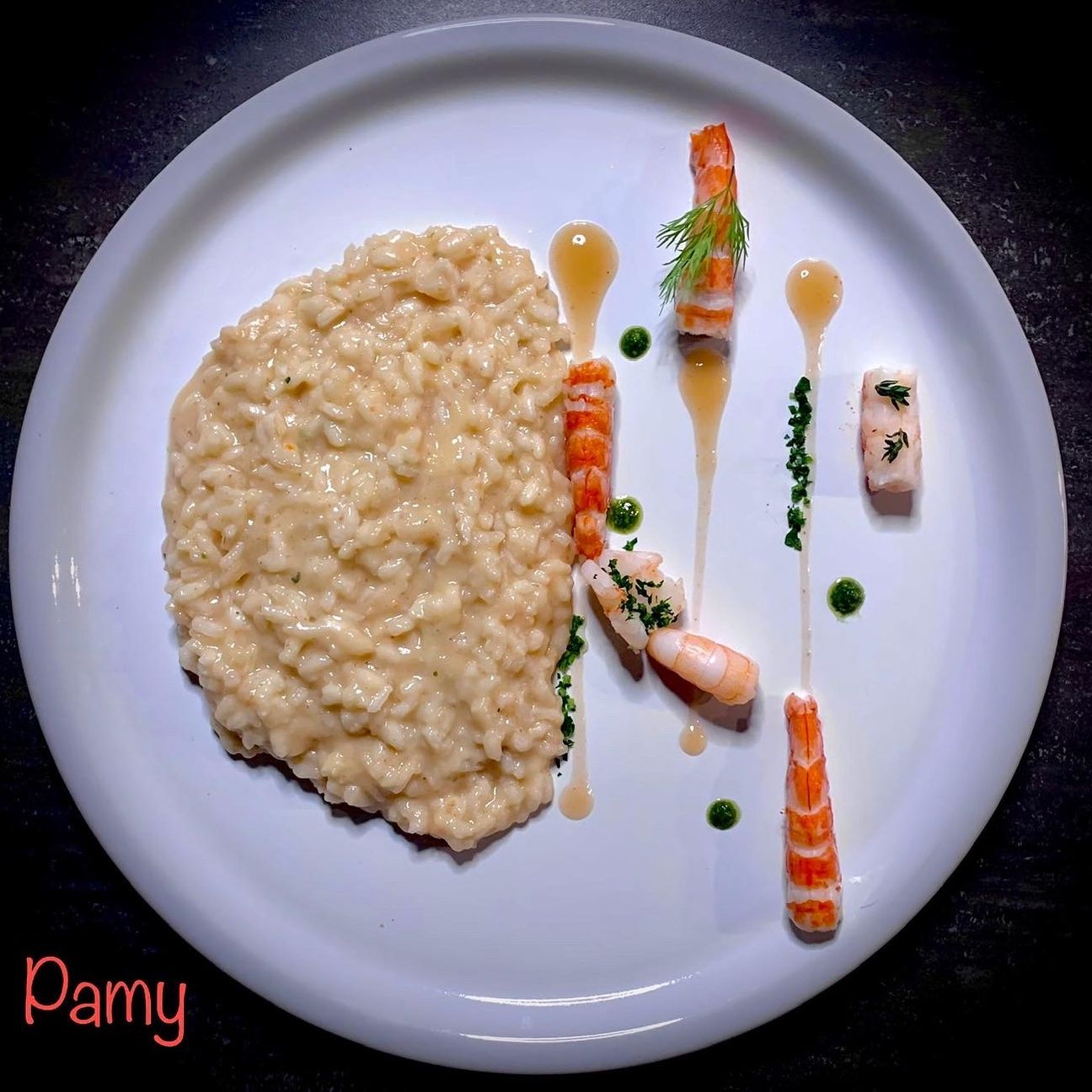 Risotto cremoso Moscato, crudo di gamberi e zeste d'arancia