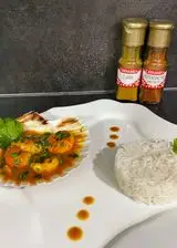 Ricetta Capesante, gamberi e scampi in salsa di curry e riso basmati