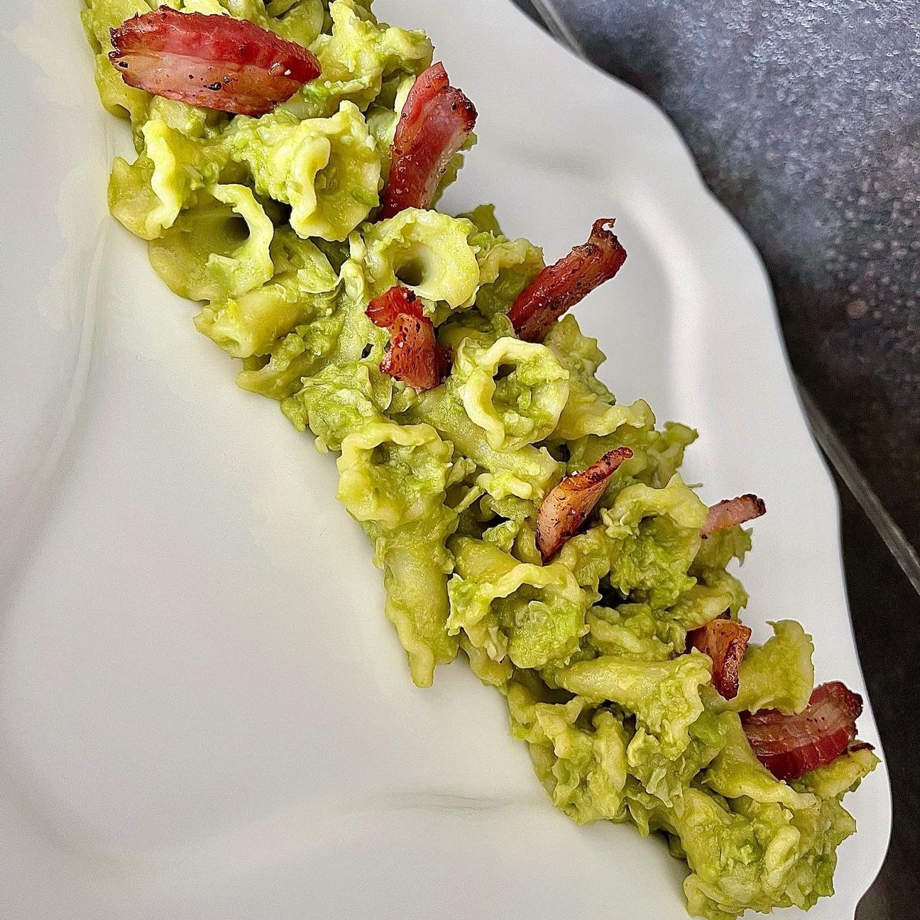 Gigli alla crema di fave con pancetta al pepe nero