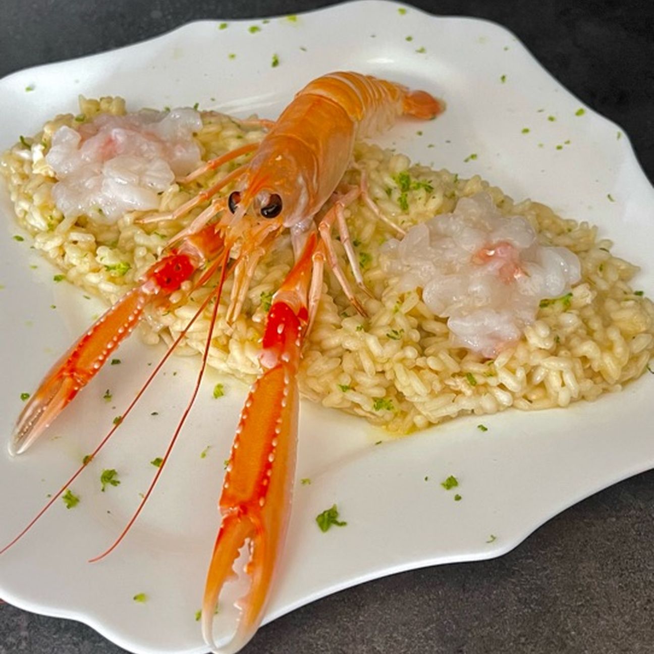 Risotto con crudo di scampi, prosecco e lime