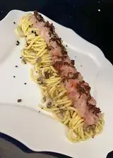 Ricetta Tagliolini al tartufo nero con crudo di scampi e gamberi rossi