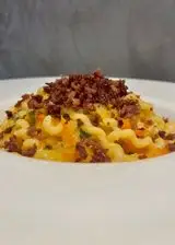 Ricetta Fusilli lunghi al pomodoro giallo e prosciutto crudo croccante