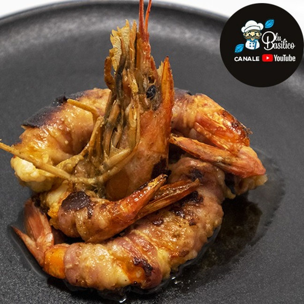 Gamberoni porchettati al brandy