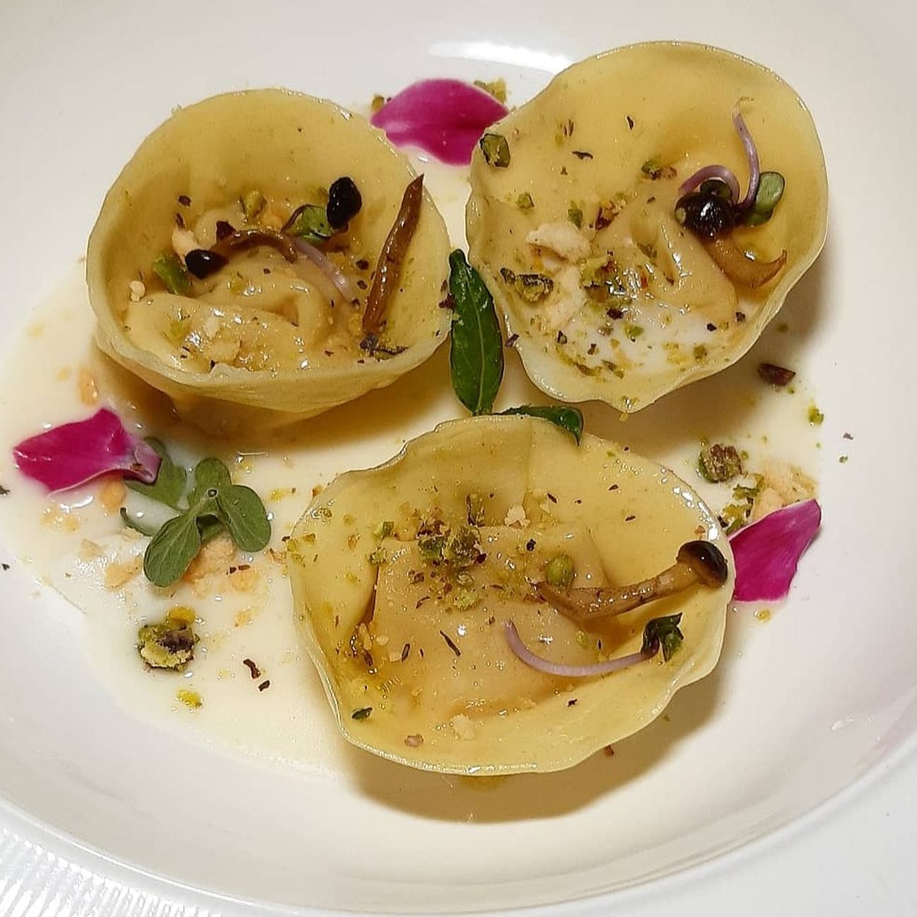 Cappelletti ripieni di zucca con crema al Parmigiano Reggiano