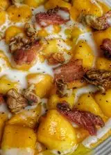 Ricetta Gnocchi con crema di zucca, pancetta affumciata e noci