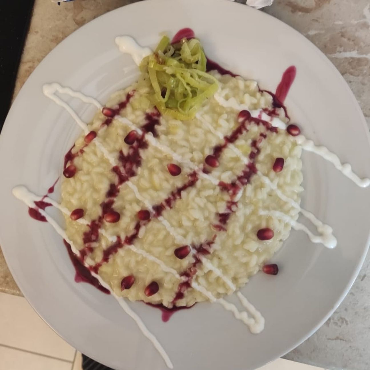Risotto al porro con melograno e certosa