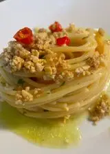 Ricetta Spaghetti aglio olio e crumble di anacardi e acciughe