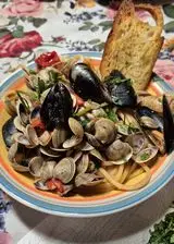 Ricetta Spaghetti allo scoglio/ Risotto allo scoglio